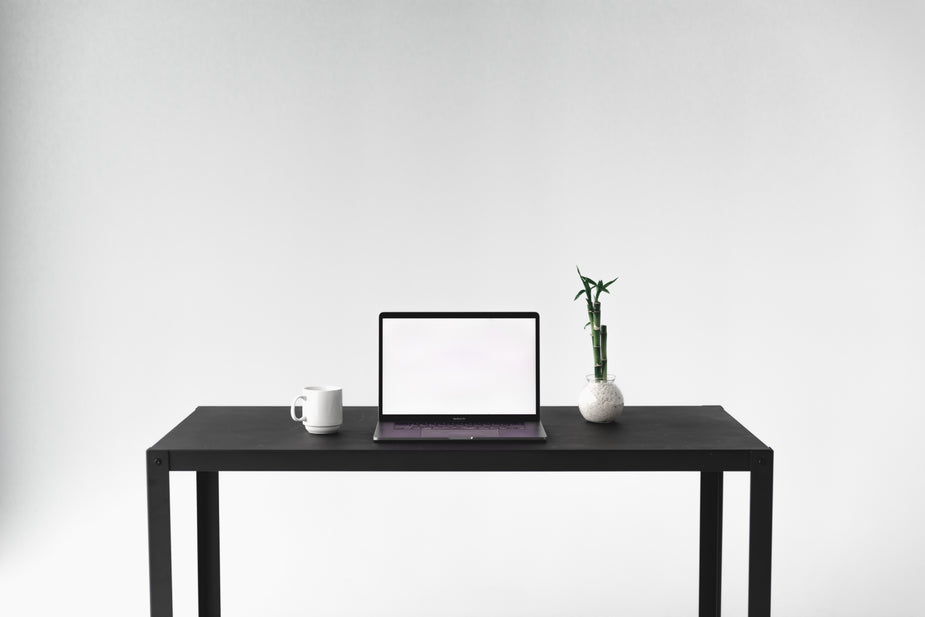 A quiet workspace with a laptop and everyday work essentials
